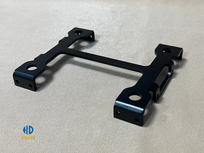 Close-up of a custom machined aluminum drone component with precision profile details