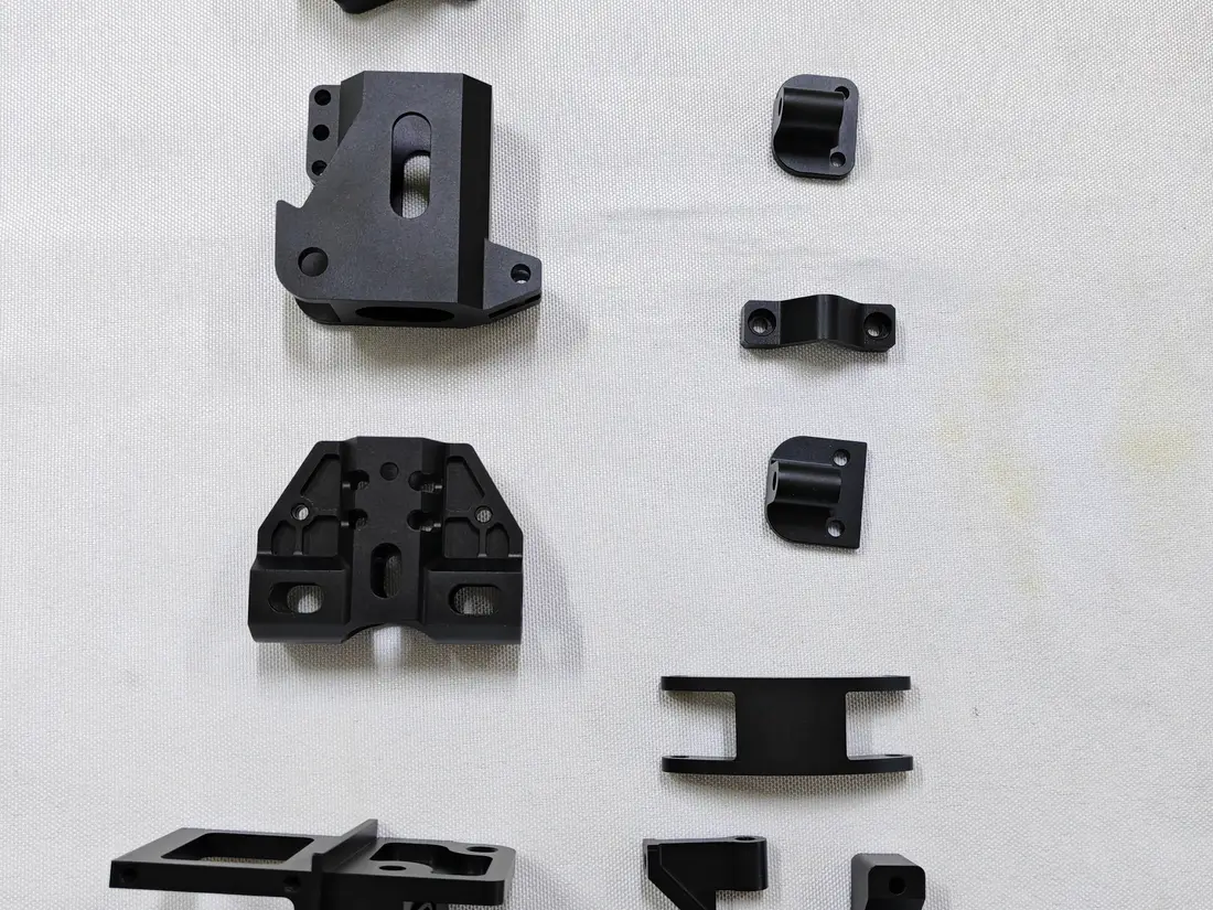 CNC machined UAV drone components including aluminum mounts plates and brackets