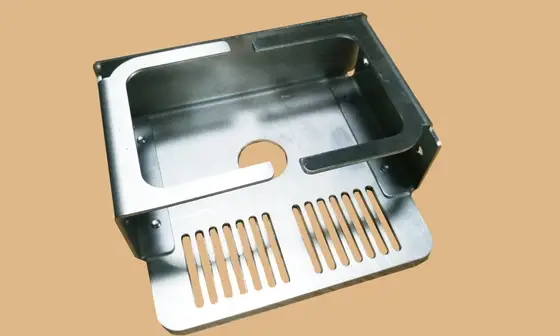 Bent sheet metal housing with vent slots