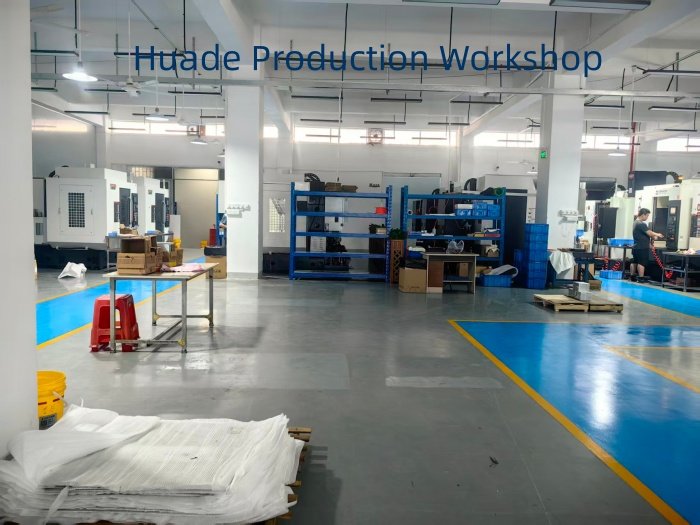 Huade Production Workshop 5 Inside view of Huade CNC machining workshop featuring clean floors and machine rows
