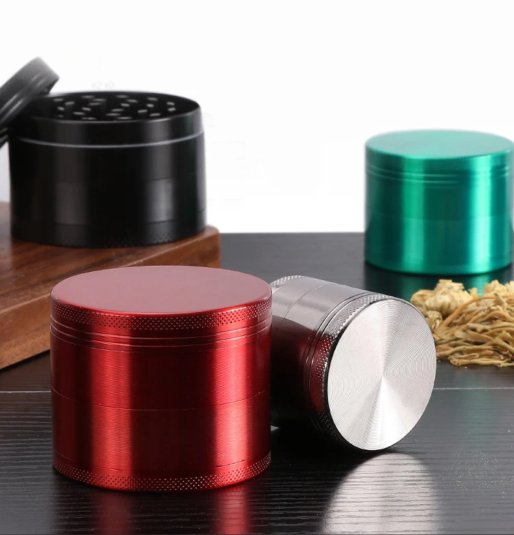 Premium anodized aluminum herb grinders in red, silver, and green finishes, manufactured by Dongguan Huade Precision.