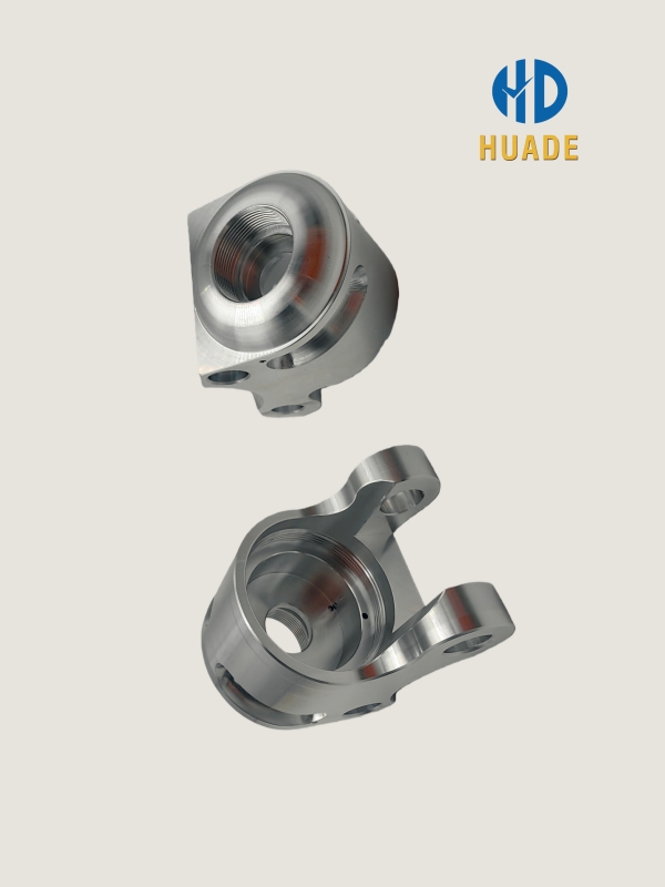 Precision CNC machined aluminum automotive suspension components with threads and flanges