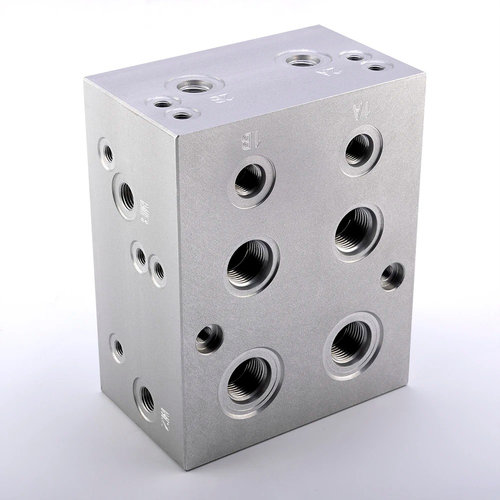 CNC machining hydraulic valve manifold blocks with multi-port routing and threaded ports