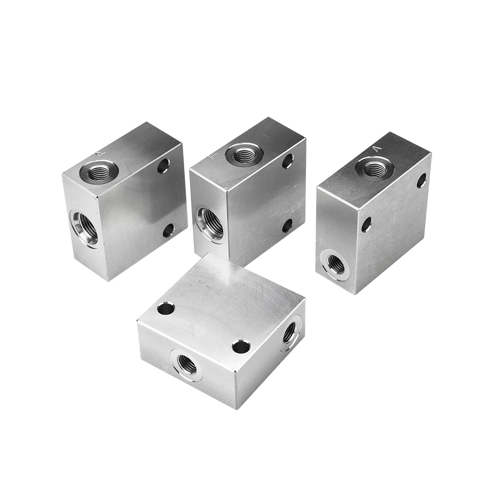 Precision custom manifold blocks CNC machining by Huade with complex internal porting.