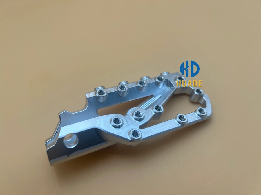 CNC machined bike pedal body top view showing threaded hole layout