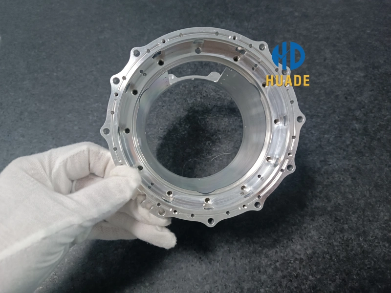 Front view of a CNC machined forged aluminum housing component with high-precision mounting holes and smooth surface finish at Dongguan Huade.